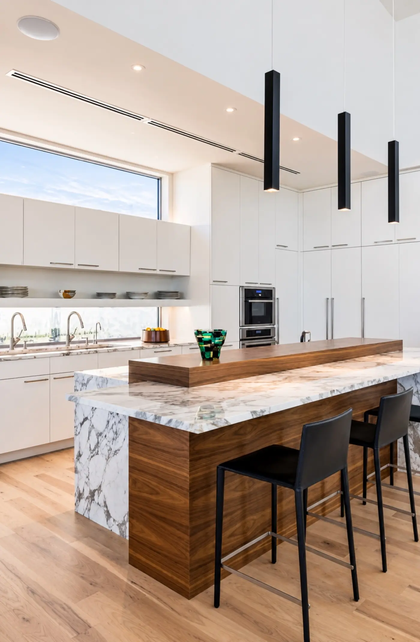 Kitchen finish inspiration with a stone island and pendant lighting